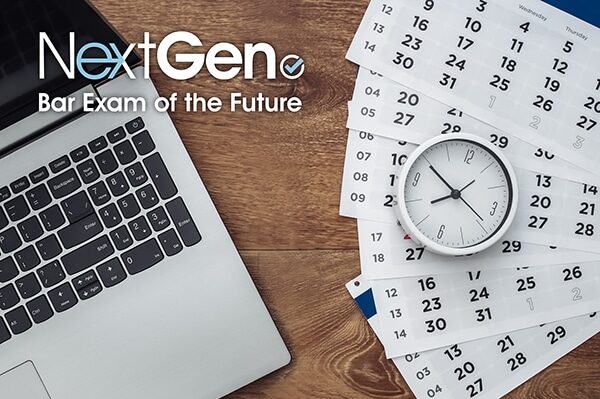 Laptop, clock, and pages of a calendar sitting on a wood surface with the NextGen Bar Exam of the Future logo overlaying the image